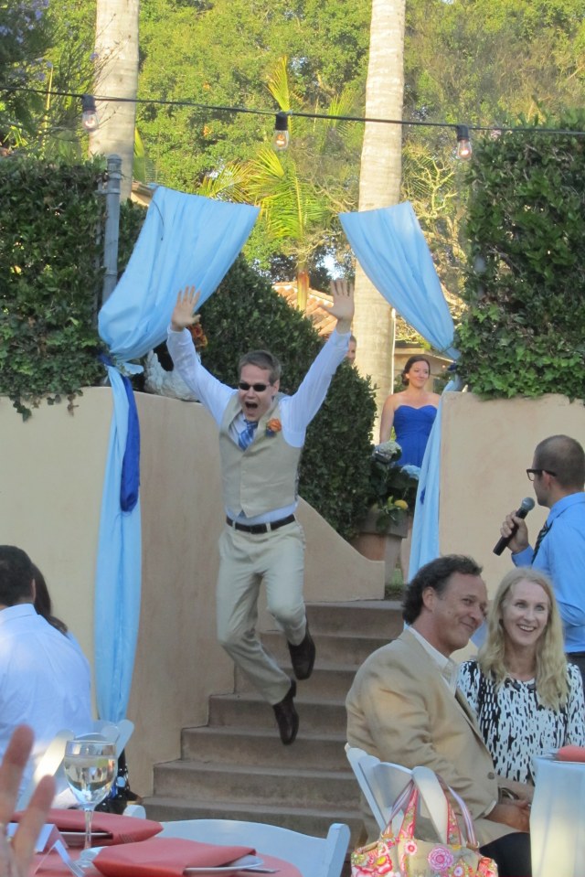 One of Andy's groomsmen making his entrance at the reception.